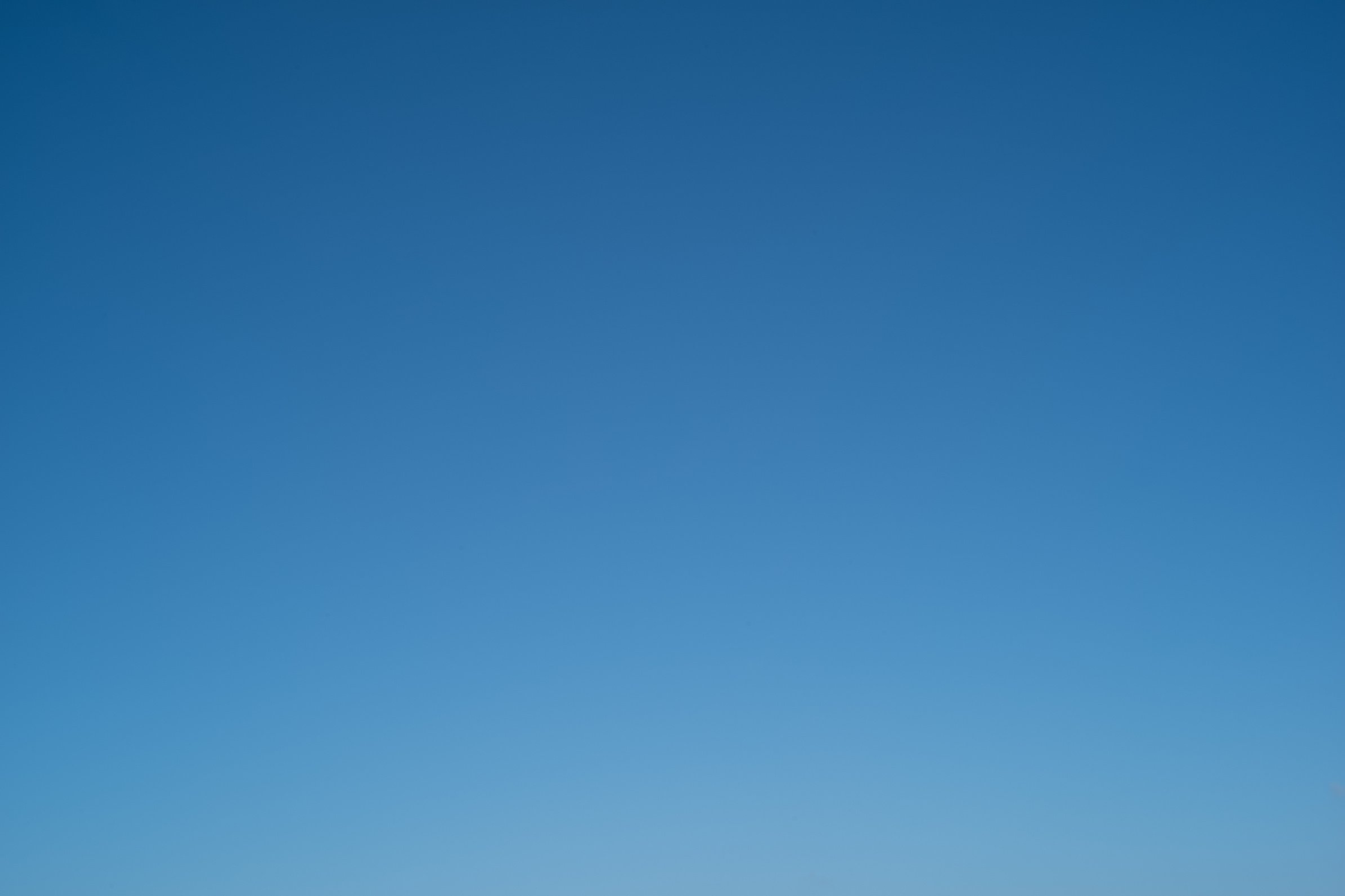 plain blue sky background